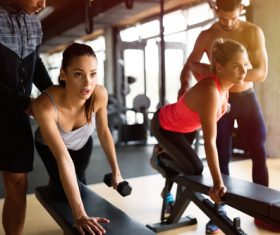 The coach guides women to do fitness exercises Stock Photo