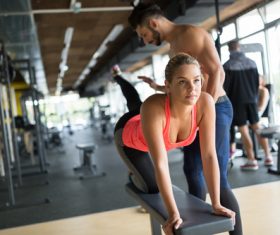The coach guides women to do leg exercises Stock Photo 01