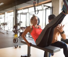 The coach guides women to do leg exercises Stock Photo 02
