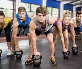The gym doing sports men and women Stock Photo