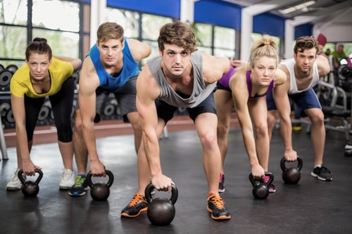 The gym doing sports men and women Stock Photo