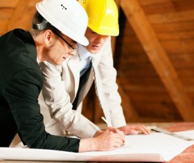 Two engineers made changes on the drawings Stock Photo