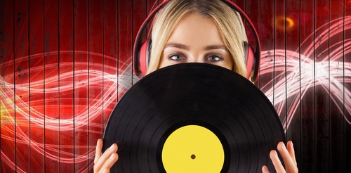 Wearing headphones girl holding a vinyl record Stock Photo 01