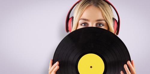 Wearing headphones girl holding a vinyl record Stock Photo 02