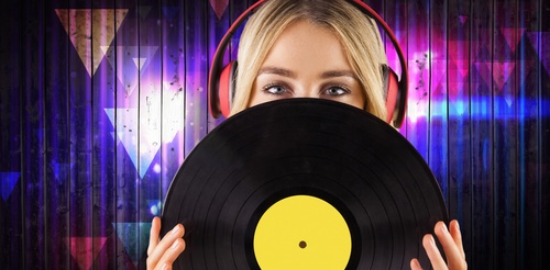 Wearing headphones girl holding a vinyl record Stock Photo 03