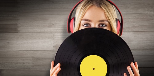 Wearing headphones girl holding a vinyl record Stock Photo 04
