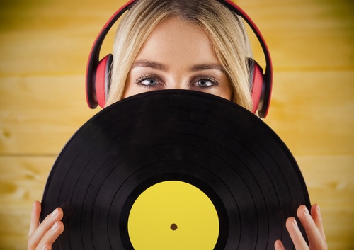 Wearing headphones girl holding a vinyl record Stock Photo 06