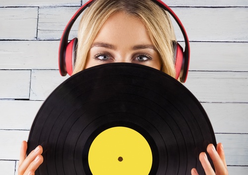 Wearing headphones girl holding a vinyl record Stock Photo 07