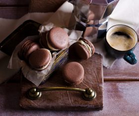 White Cream Macaroon and Coffee on the Desktop Stock Photo 01