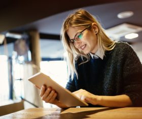 Woman Uses tablets pc Stock Photo