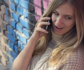 Woman answering the phone Stock Photo 02