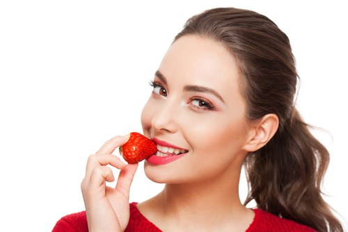 Woman eating strawberry Stock Photo free download