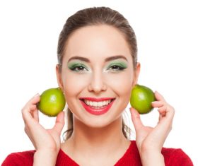Woman green eyeshadow and lemon Stock Photo