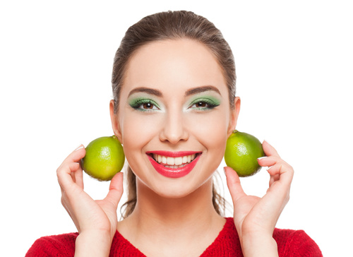 Woman green eyeshadow and lemon Stock Photo