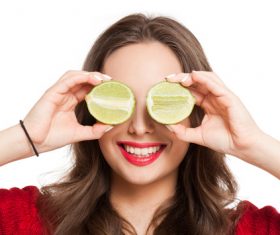 Woman holding cut lemon Stock Photo
