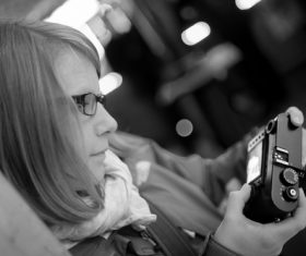 Woman looking at photos taken in the camera Stock Photo