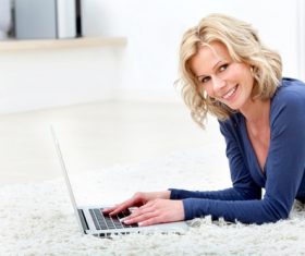 Woman lying on the carpet Internet Stock Photo