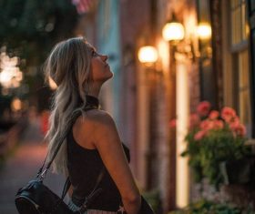 Woman on the street in the evening Stock Photo