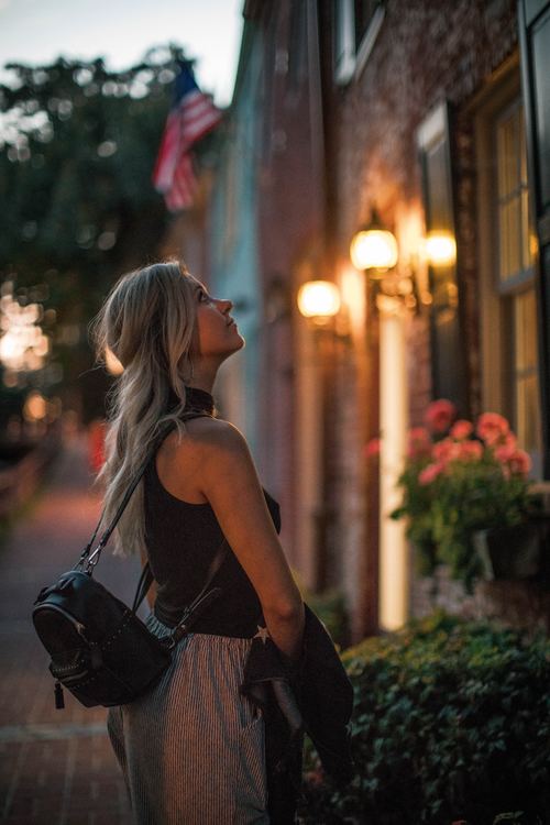 Woman on the street in the evening Stock Photo