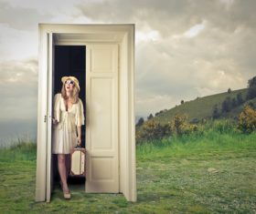 Woman opens the magic door Stock Photo