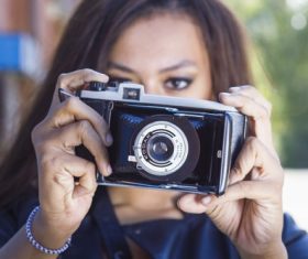 Woman taking photo with camera Stock Photo 01