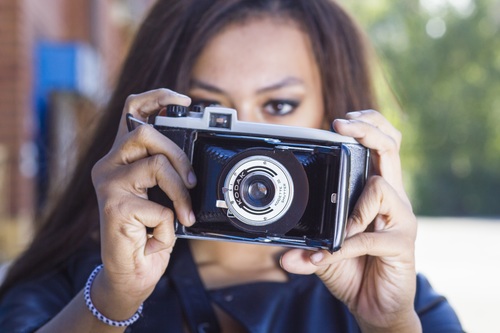 Woman taking photo with camera Stock Photo 01