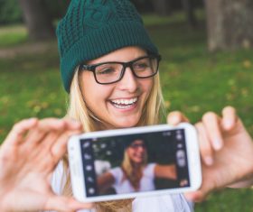 Woman wearing a knitted cap selfie Stock Photo