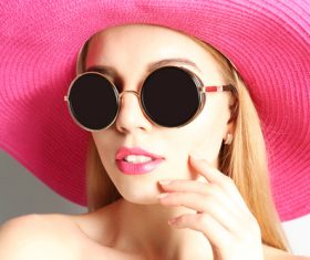 Woman wearing pink sunhat Stock Photo 01