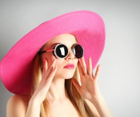 Woman wearing pink sunhat Stock Photo 02