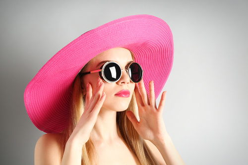 Woman wearing pink sunhat Stock Photo 02