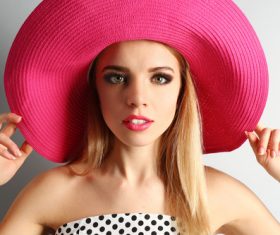 Woman wearing pink sunhat Stock Photo 03