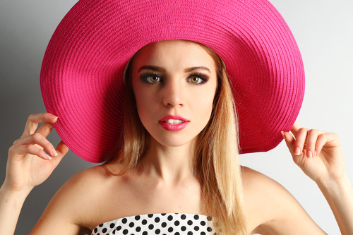 Woman wearing pink sunhat Stock Photo 03
