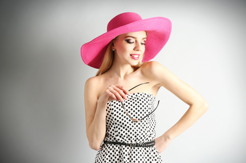 Woman wearing pink sunhat Stock Photo 06