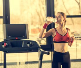 Woman who replenishes water after exercise Stock Photo