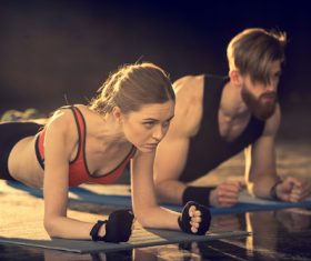 Women push-ups together with coach Stock Photo 02