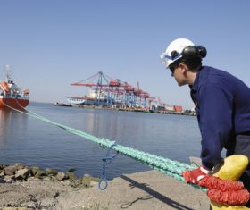 Worker detecting ship rope Stock Photo