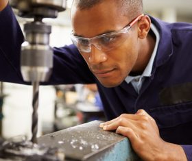 Worker punched with machine Stock Photo