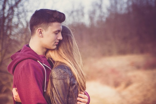 Young couple hugging together Stock Photo