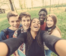 Young friends taking selfies Stock Photo