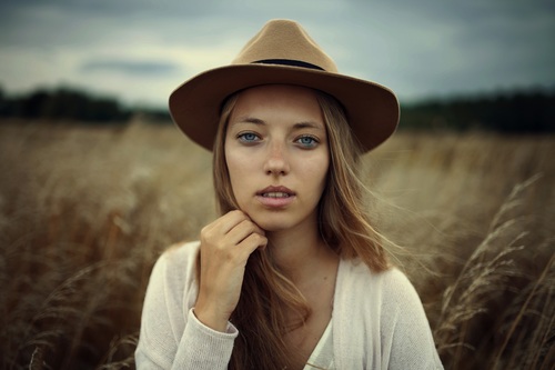 Young girl wearing hat outdoors Stock Photo