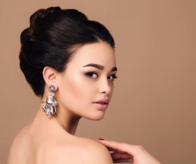 Young woman turns and looks back Stock Photo