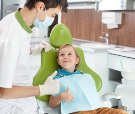dentist praised the child for being brave Stock Photo