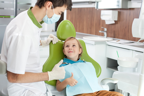 dentist praised the child for being brave Stock Photo