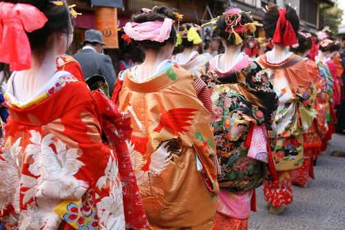 geisha wearing a Japanese kimono cruises the street Stock Photo