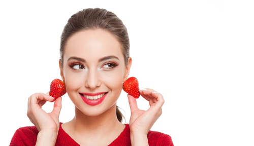woman who uses strawberries as earrings