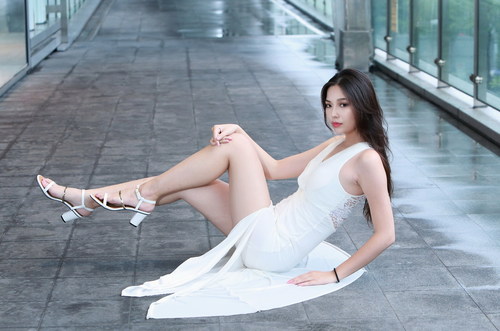 Asian girl sit on the ground pose Stock Photo