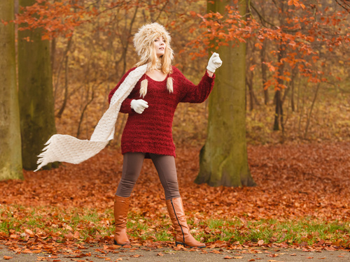 Autumn woman in warm clothes is doing sports Stock Photo