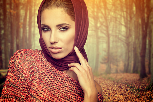 Autumn woman wearing sweater and headscarf Stock Photo