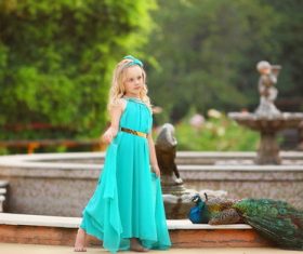 Cute little girl and peacock Stock Photo