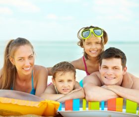 Family in the swimming pool Stock Photo